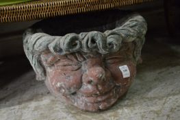 An unusual figural garden pot.