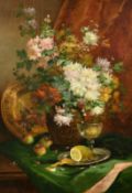Eugene Henri Cauchois (1850-1911), a still life of flowers in a vase with a glass, fruit and other