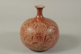 A MATA ORTIZ POTTERY BULBOUS VASE decorated with sunflowers. 7.5ins high.