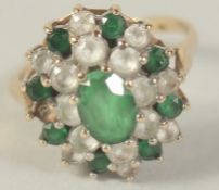 A 9CT GOLD GREEN AND WHITE CUBIC ZIRCONIA RING