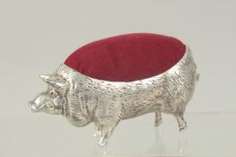 A LARGE PIG PIN CUSHION. 4ins high.