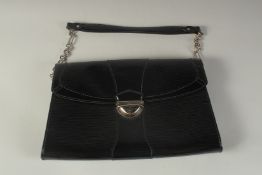 A LOUIS VUITTON BLACK PATENT HAND BAG. 12ins long