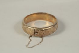 A GILDED SILVER BANGLE.