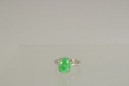 A WHITE GOLD SINGLE STONE JADE RING.