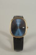 A PATEK PHILIPPE, MODEL 3747 18K YELLOW GOLD WRIST WATCH with sunburst cobalt blue dial and