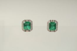 A GOOD PAIR OF EMERALD AND DIAMOND OCTAGONAL STUD EARRINGS.