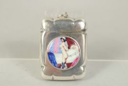 A PLAIN SILVER VESTA with a circular enamel with nude, beside a bath.