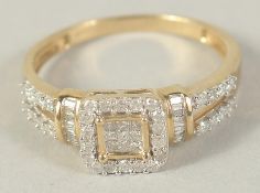 A 9 CT GOLD DIAMOND CLUSTER RING with princess cut diamonds.