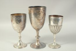 THREE VARIOUS SILVER CHALLENGE CUPS, two engraved, one plain. Weight; 24ozs.