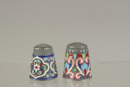 TWO RUSSIAN SILVER AND ENAMEL THIMBLES.