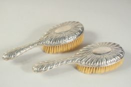 A PAIR OF SILVER BACK HAIR BRUSHES. London 1905.