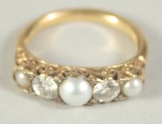 A THREE STONE PEARL AND TWO STONE DIAMOND RING. Size I.