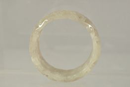 A GOOD CHINESE PIERCED AND CARVED BANGLE. 7cms diameter x 3cms deep.