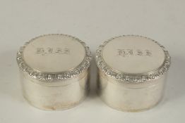 A PAIR OF GEORGIAN SILVER CIRCULAR POTS AND COVERS, engraved 
