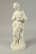 A MiNTON PARIAN FIGURE OF PANDORA holding a casket and standing on a circular base. 17.5ins high.