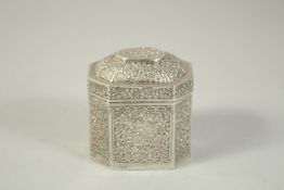 A SMALL BURMESE SILVER TEA CADDY AND COVER. 3ins high.
