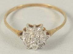 A 9CT GOLD DIAMOND CLUSTER RING