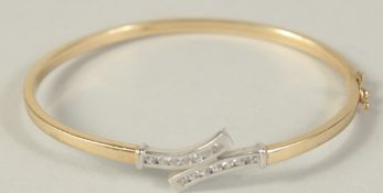 A 9CT GOLD BANGLE