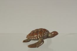 A JAPANESE BRONZE TURTLE. 5cms long.