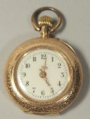 A LADIES 14CT GOLD AND BLUE ENAMEL FOB WATCH.