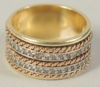 AN 18CT GOLD DIAMOND BAND RING