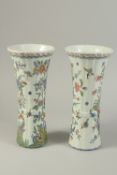 A PAIR OF DUTCH FANCY POLYCHROME POTTERY VASES, painted with birds and butterflies. 12ins high.
