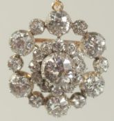 A SUPERB DIAMOND CLUSTER PENDANT, WITH BROOCH FITTING, centre stone approx. 1.5 carat, surrounded by