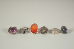 SIX VARIOUS RINGS.