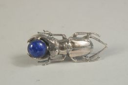 A SILVER AND LAPIS SCARAB BROOCH.