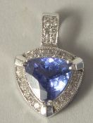 AN 18CT WHITE GOLD DIAMOND AND TANZANITE PENDANT