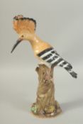 A MEISSEN HOOPOE, first modelled by Joachim Kaendler. Circa. 1840. 31.2cm high. Cross sword mark