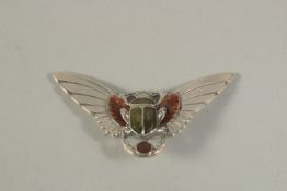 A SILVER AND ENAMEL SCARAB AND WINGS BROOCH.