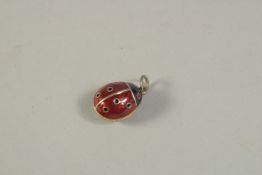 A SILVER AND ENAMEL LADYBIRD PENDANT. 2cms.