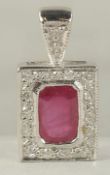 A TINY 18K WHITE GOLD RUBY AND DIAMOND PENDANT.