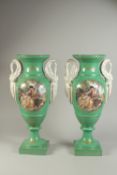 A PAIR OF SEVRES DESIGN GREEN GROUND TWO-HANDLED VASES with classical scenes and swan handles. 19ins