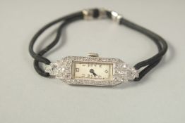 A DECO PLATINUM AND DIAMOND COCKTAIL WATCH.