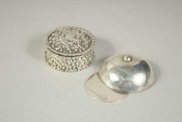 AN IRISH SILVER JOCKEY CAP CADDY SPOON. Dublin 1849 and a small circular box. (2).