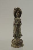 A CHINESE BRONZE THREE FIGURE DEITY. 10ins high.