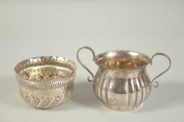 A SMALL VICTORIAN WRYTHERN FLUTED CIRCULAR BOWL AND A TWO HANDLE SUGAR BASIN (2)