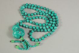 A TURQUOISE BEAD NECKLACE AND PENDANT. 90cms long.