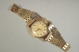 A LADIES INTERNATIONAL WATCH CO. 9CT GOLD WRIST WATCH AND BRACELET. Gross weight: 21gms