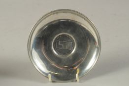A CARTIER BOXED PEWTER CIRCULAR DISH. 4.75ins diameter.