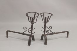 A GOOD PAIR OF EARLY WROUGHT IRON FIRE DOGS. 21ins high, 21ins long, with circle tops.