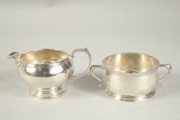 A MAPPIN AND WEBB CIRCULAR SILVER MILK JUG. Sheffield 1940 and A TWO HANDLED BOWL, 3.5ins