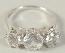 A 9CT GOLD CUBIC ZIRCONIA THREE STONE RING