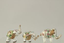 A SET OF THREE SMALL CLOISONNE ENAMEL ELEPHANTS. 5.5cms.