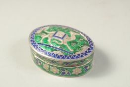 A SMALL INDIAN ENAMELLED SILVER LIDDED BOX, with camel design, 5.5cm wide.