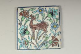 AN EARLY 20TH ARMENIAN JERUSELUM GLAZED POTTERY TILE, depicting a deer, 12.5cm x 12.5cm.