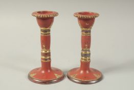 A PAIR OF TURKISH TOPHANE CANDLESTICKS, 18cm high.