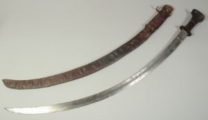 A FINE 18TH-19TH CENTURY ETHIOPIAN RHINO HORN HILTED SWORD, blade with etched portrait of a ruler as